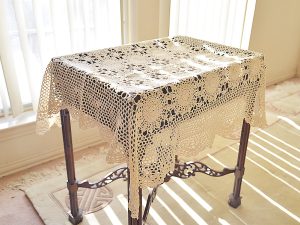 36" square crochet table topper. ecru/wheat color