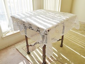 White color, crochet square table topper. 45"square.